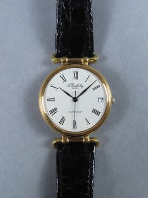 a close up of a wrist watch with roman numerals