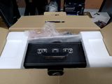 a box with a black and white electronic device inside of it