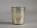a silver cup that is sitting on a table
