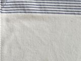 a close up of a white and blue striped shirt with a pocket