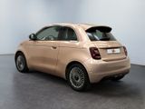 the small car is parked in the empty room of the showroom
