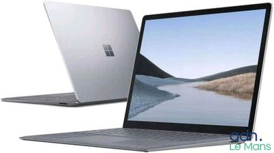 two laptops side by side with one open and the other closed