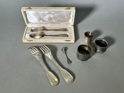 a silverware set in a wooden box on a table