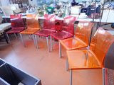 a lot of chairs that are sitting in a room