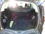 the back of a car with the trunk open and the seats down