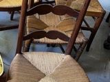 many chairs that are lined up in a room