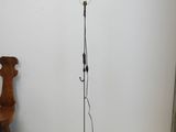 a lamp that is on a stand in a room