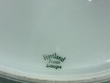 a white plate that has a green label on it