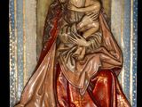 a statue of a woman holding a child in her arms