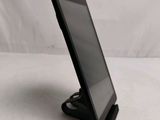 a tablet that is sitting on a stand on the table