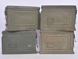 three old metal boxes stacked on top of each other on a white surface