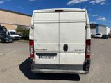 a white van that is parked in a parking lot