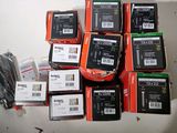 a pile of electronic equipment sitting on a table