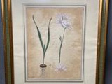 a picture of a picture of two flowers in a gold frame