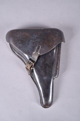 silver colored leather case with a metal clasp on a white surface