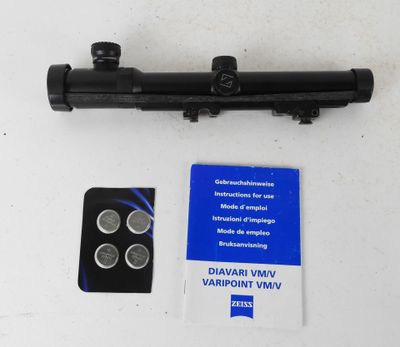 a close up of a black pipe with four batteries and a card