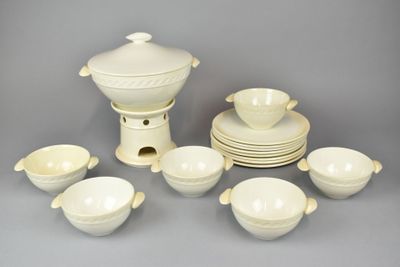 a lot of white dishes and cups on the table