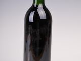 a bottle of wine that is sitting on a table