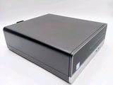 an image of a small black computer on a white surface