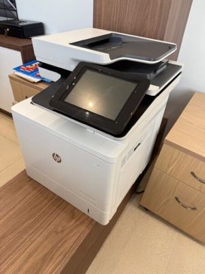 a printer that is sitting on top of a desk