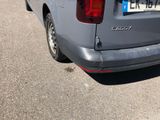 a grey van that is parked on the side of the road