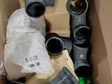 a cardboard box filled with different types of plumbing equipment