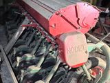 a machine that is sitting in the middle of a pile of dirt