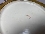 a close up of a white vase with a red line on it
