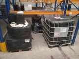 two black barrels sitting next to each other in a warehouse