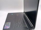 a black laptop computer sitting on a white surface