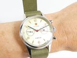 a close up of a wrist with a watch on it