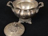 silver plated bowl with lid and lid with a lion on it