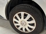 a white car that has a flat tire on it
