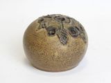 an image of a ceramic object on a white surface