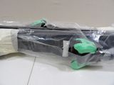 a snowboard that is wrapped in plastic on the floor
