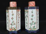 pair of chinese vases with flowers and birds painted on them