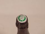 a close up of a bottle of beer on a table