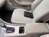 a remote control in the center console of a car