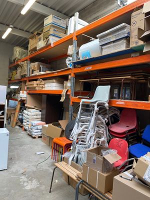 a room filled with lots of boxes and chairs