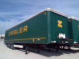 a green semi trailer with a yellow ziegler logo on it