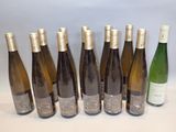 six bottles of wine are lined up in a row on a table