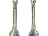 two forks and spoons sitting next to each other