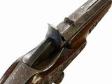 an old gun with a wooden handle on a white background