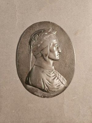 a silver coin with a woman ' s profile on it