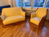 two chairs that are next to each other in a room