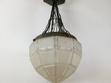 a close up of a light fixture on a white wall