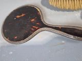 a brush and a brush sitting on top of a table