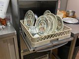 a dishwasher with dishes in a dishwasher in a kitchen