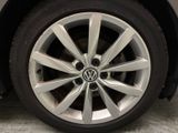 a close up view of a car ' s wheel and tire