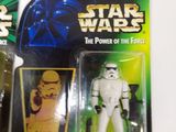 three star wars action figures are shown on a white surface